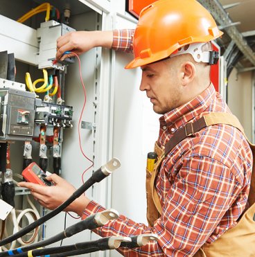 Electrician Working on Electrical Panel